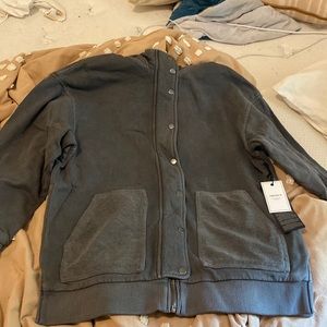 Unworn oversized gray hooded jacket.